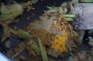 Add spices and allow them to cook for a few minutes, stirring to keep them from burning.