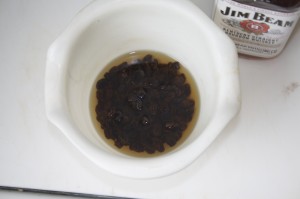 Soak bourbon and raisins together in a small bowl.