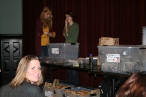 Urban compsoting made simple by Tara DePort, LOSEC Program Director (background, left) and Carey Pulverman, LOSEC's Manhattan Project Manager (background, right). Copywriters' Kitchen's Lorraine Thompson (foreground, left), thrilled to be inching toward a green kitchen.