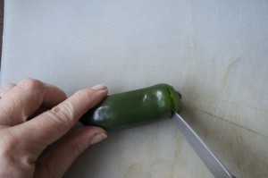 Use paring knife to slice off top of jalapeno.