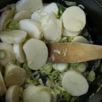 Pan fry potatoes and leeks over a low flame for a few minutes.