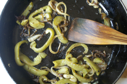cooked-peppers-onions-in-pan