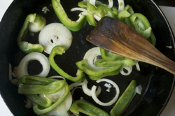 raw-peppers-onions-in-pan
