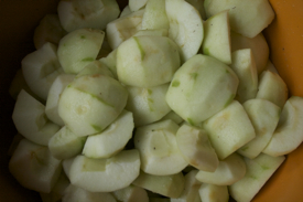 quartered-apples-orange-bowl-close